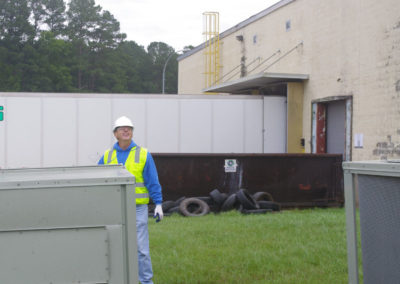 team member standing behind commercial unit