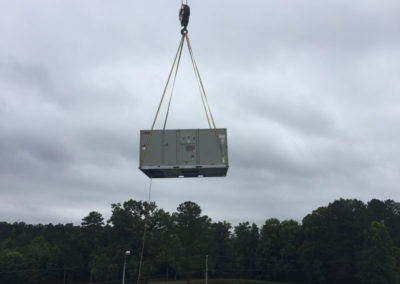 large hvac unit lifted in the air