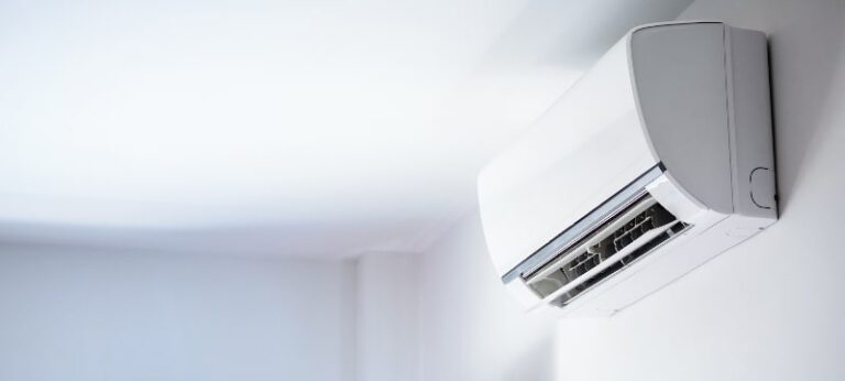 Ductless air conditioner on white wall room interior background